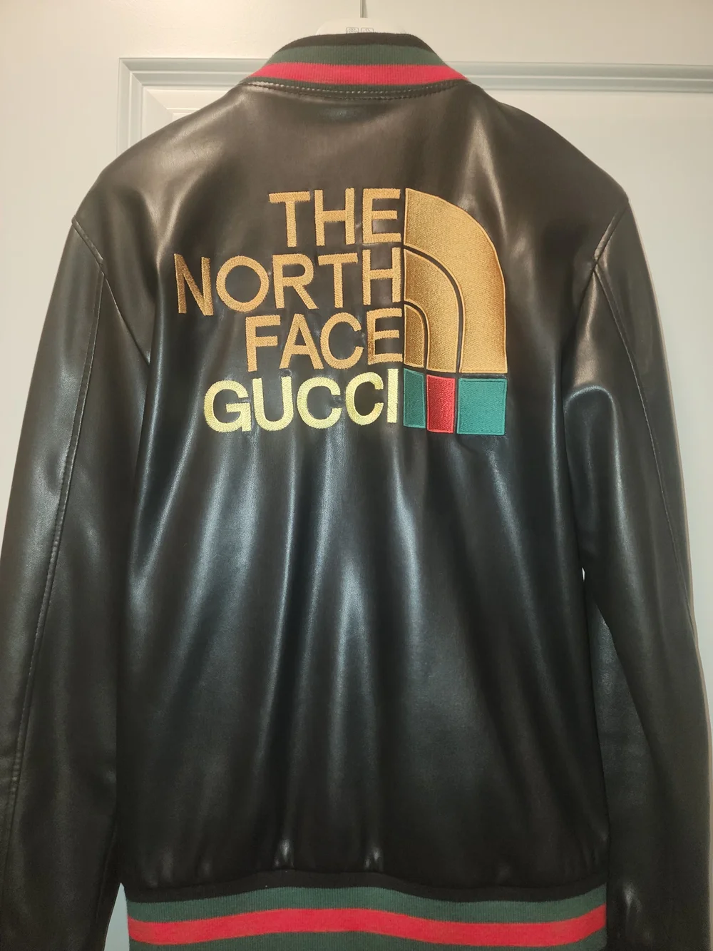 Gucci Black Leather Bomber Jacket with Gold Logo and Red-Green Trim